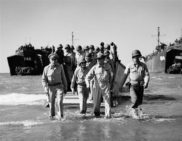 General MacArthur and his officers wading ashore from landing craft at Luzon in 1945, the black and white scan